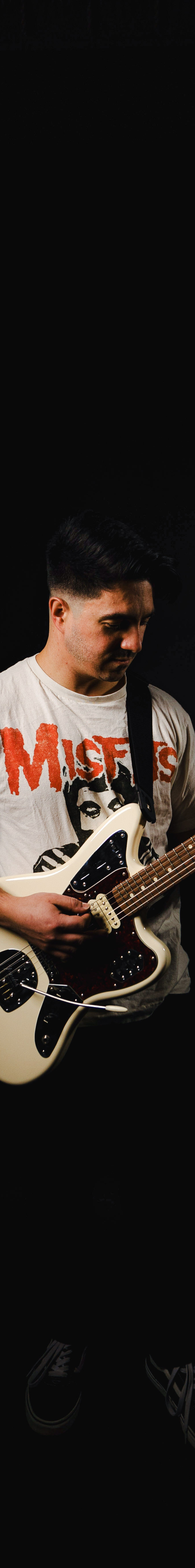 Neil Scalesse playing guitar